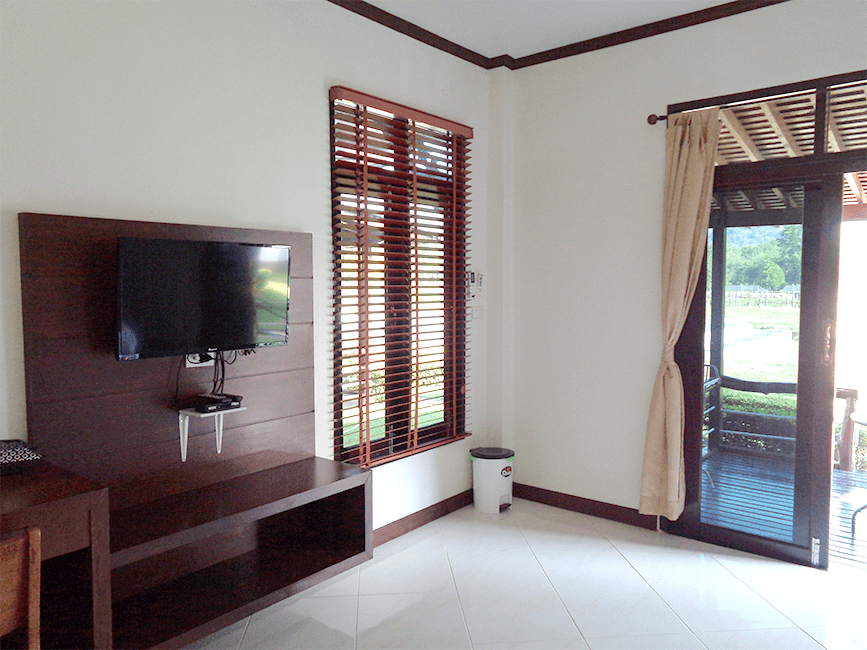 Comfortable bungalow bedroom with king size bed