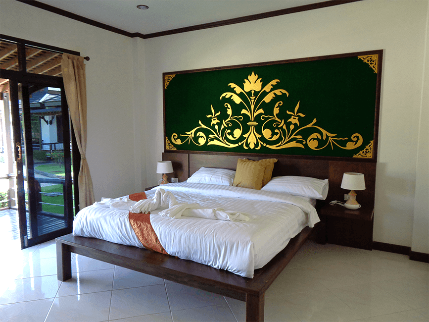 King bed with green decor